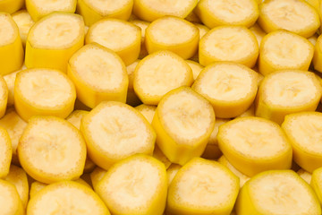 Fresh banana slices background. Top view.