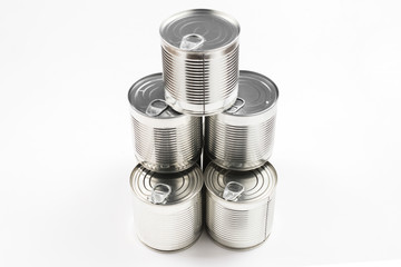 Group of silver canned food on white background.