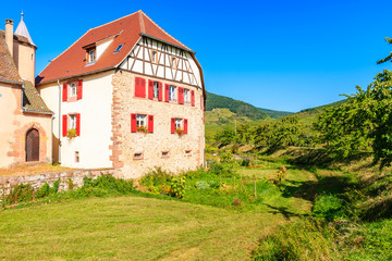 Old typical French house in Kientzheim village on Alsatian Wine Route, France