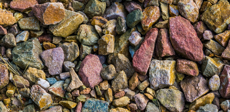 gravel stones in diverse colors in closeup, stone pattern background