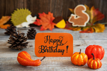 Orange Label With English Text Happy Birthday. Autumn Decoration Like Pumpkin, Hedgehog And Squirrel