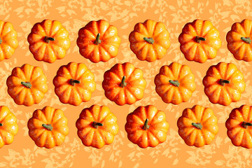 Pumpkin pattern on a orange color background with water color style.