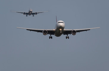 Airplane flies against a background of blue sky