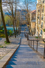 Montmartre in Paris, a very romantic parisian street with typical stairs and lamppost 
