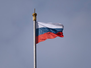 Russian flag fluttering in the wind on a flagpole