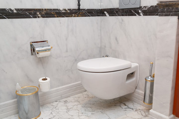 Hanging on wall white toilet bowl, grey natural marble