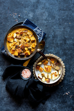 Indian Vegetarian Dinner - Shahi (Royal) Paneer Curry , Cumin Rice and Rice Flatbread with onion and green chiles.