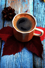 cup of coffee on wooden background