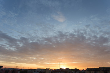 Colourful sunset over a dark city