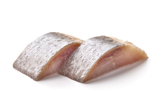 Salted herring with fresh green basil, isolated on white background