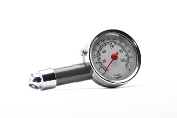 Pressure gauge for measuring air pressure in car tires on a white background