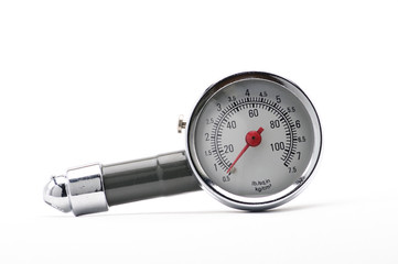 Pressure gauge for measuring air pressure in car tires on a white background