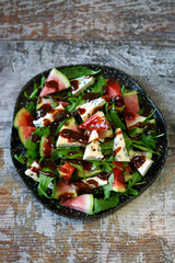 Healthy salad with blue cheese, watermelon and arugula. Healthy food. Keto diet.