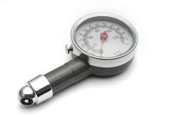 Pressure gauge for measuring air pressure in car tires on a white background
