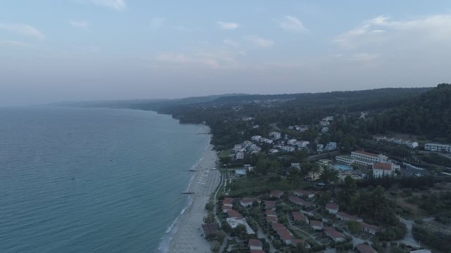Aerial view. Big resort complex located by the coast of Mediterranean Sea. Resort complex located next to Kallithea village, Greece4K