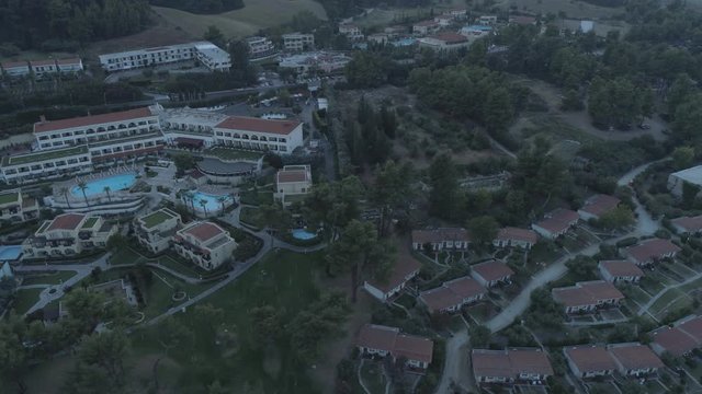 Aerial view. Big resort complex located by the coast of Mediterranean Sea. Resort complex located next to Kallithea village, Greece4K