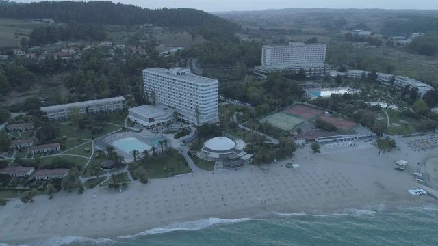 Aerial view. Big resort complex located by the coast of Mediterranean Sea. Resort complex located next to Kallithea village, Greece4K