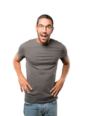 Fototapeta premium Amazed young man looking up gesture