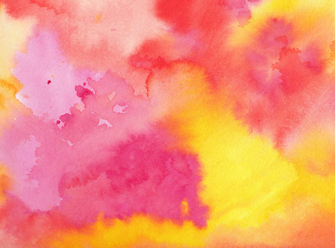 watercolor background in pink orange yellow and purple colors in a beautiful abstract painted sunrise or sunset with clouds in artist design