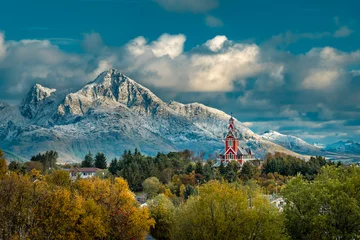  Red Buksnes church in front of snowy mountains at Lofoten Islands © mrpluck