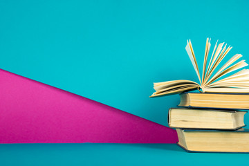 Open book, hardback books on wooden table. Back to school. Copy space