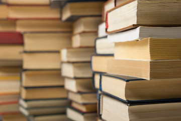 Stack of books background. many books piles.