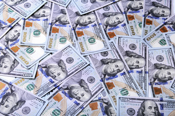 A pile of dollar bills. Background from american money one hundred dollars.