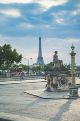 Fototapeta na wymiar Statue next to Place de la Concorde and Eiffel Tower in background, Paris, France.