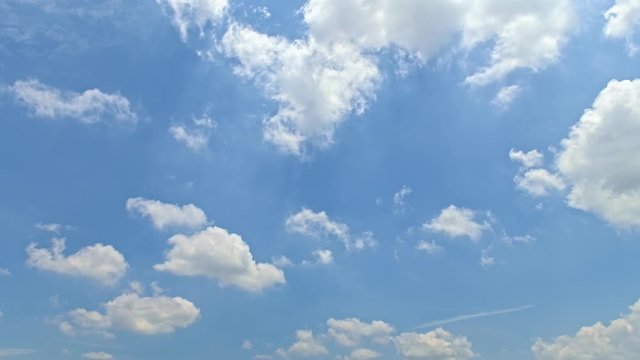 4K resolution Time lapse view of white cloud moving over blue sky background.  Time lapse clouds, rolling puffy cloud are moving, white lightness clouds time lapse.