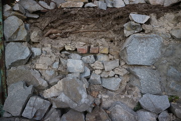 Stone wall background. Ruined wall. Crashed wall. Ruined brick wall.