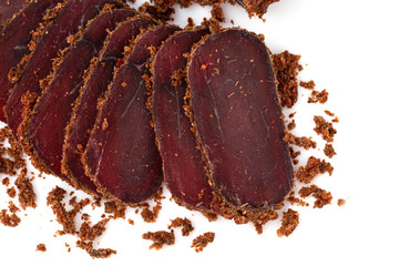 Jerky on a white background. Close-up of basturma sliced into pieces.