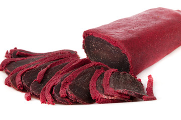 Fototapeta premium Jerky on a white background. Close-up of basturma sliced into pieces.
