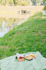 Morning picnic in the park. Tasty food. Snacks and fruits. Picnic basket. Lifestyles