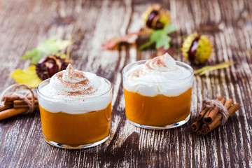 Autumn dessert, pumpkin mousse with whipped cream