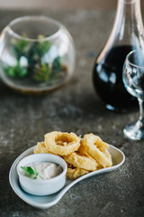 breaded squid rings with tartar sauce.  