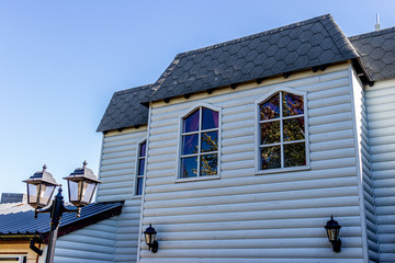 white whale of house with reflection in windows