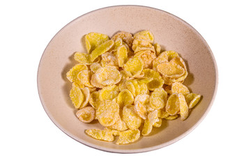 Ceramic plate with cornflakes isolated on a white background. Healthy eating