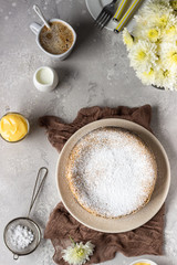Poppy seed cake with powdered sugar and custard with a cup of coffee. Traditional Polish poppy seed cake – Makovnik. Delicious breakfast or dessert. 