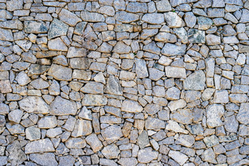 Background of grey natural granite wall.