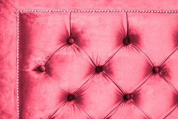 Pink luxury velour quilted sofa upholstery with buttons, elegant home decor texture and background