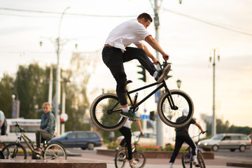 The guy jumps up to BMX from the parapet.