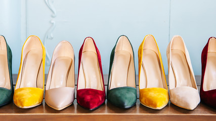Women's shoes on the chair. Women's shoes with heels in various colors