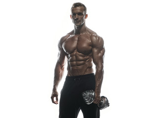 Fototapeta na wymiar Fitness model man posing in studio
