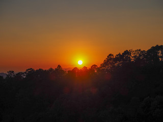 Sunset black silhouette at Chiang Dao Mountain The light of the evening sun made the forest dark.