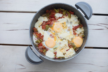 Traditional turkish food menemen made by eggs and tomatoes.
