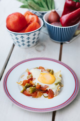 Traditional turkish food menemen made by eggs and tomatoes.