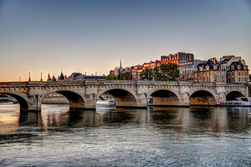 Fototapeta na wymiar Buildings and bridges along the Seine River in Paris