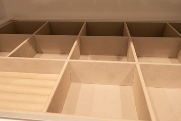 Extendable shelf for ties and watches, covered with velvet fabric. Inside the wardrobe.