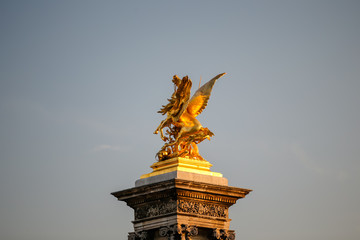 Bridge and sculptures atop the Pont Alexandre III bridge in Paris