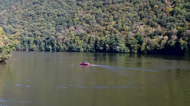 Aerial view of a motorboat getting ready for water skiing in Raystown lake, Pennsylvania.